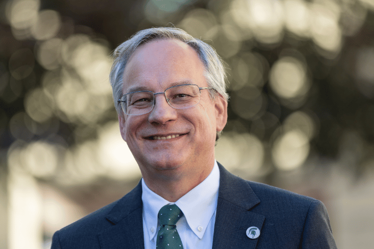 Dean Aron Sousa's final headshot with the College.